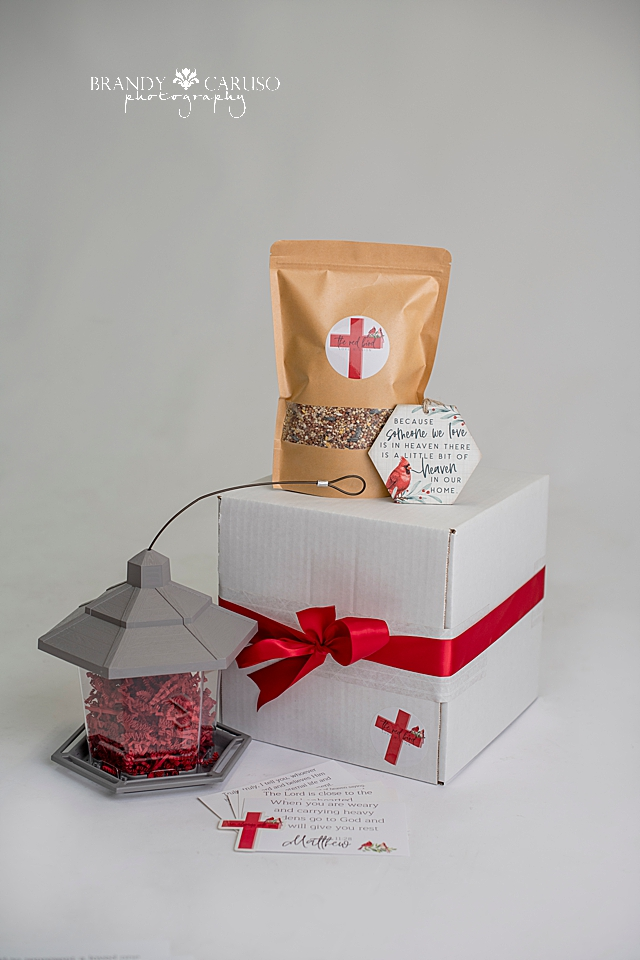 A Cardinal themed sympathy gift box based on the qoute when cardinals appear angels are near. Come with a bird feeder, bird seed, a Cardinal qoute wooden ornament. Sympathy gift for people grieving
