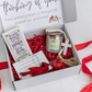 Cardinal themed gift box that includes a Cardinal quote candle, a cross, a Cardinal ornament and a table top quote 