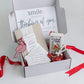 Cardinal themed sympathy gift box that includes a guided grief journal, assorted Cardinal trinkets, a cross and a Cardinal table qoute. 